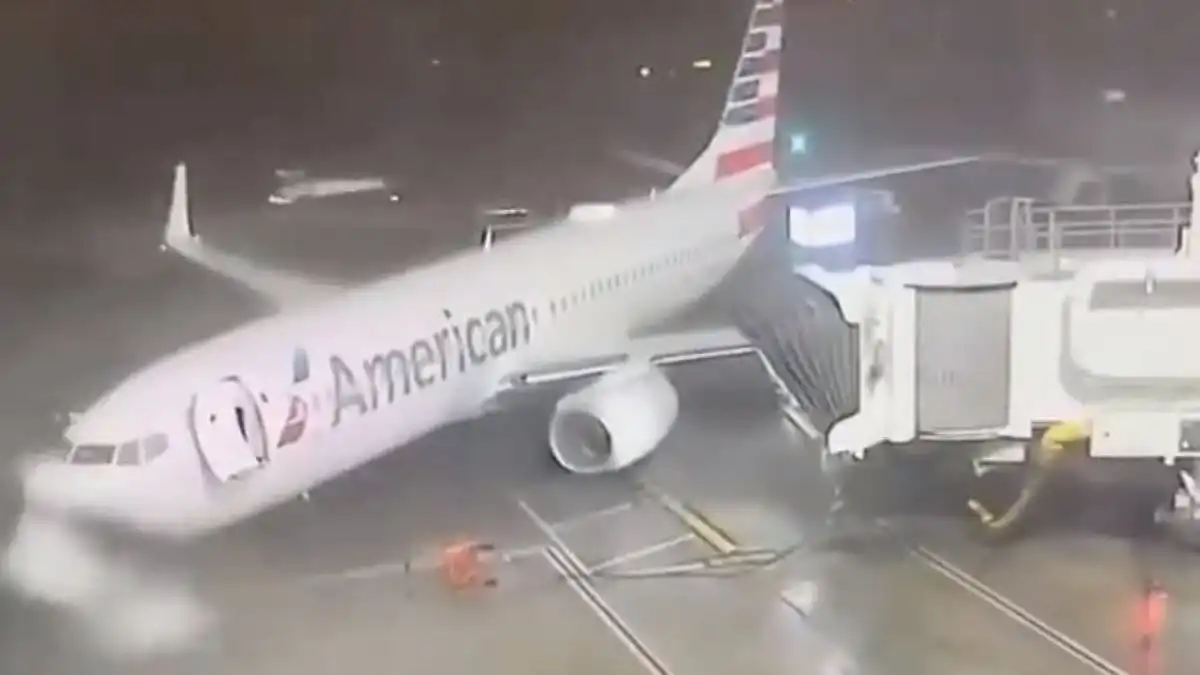 American Airlines Boeing 737 plane blown across tarmac in Dallas