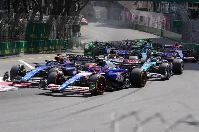 Big crash Monaco GP 1st lap involving 3 cars brings out red flag racing temporary halt.
