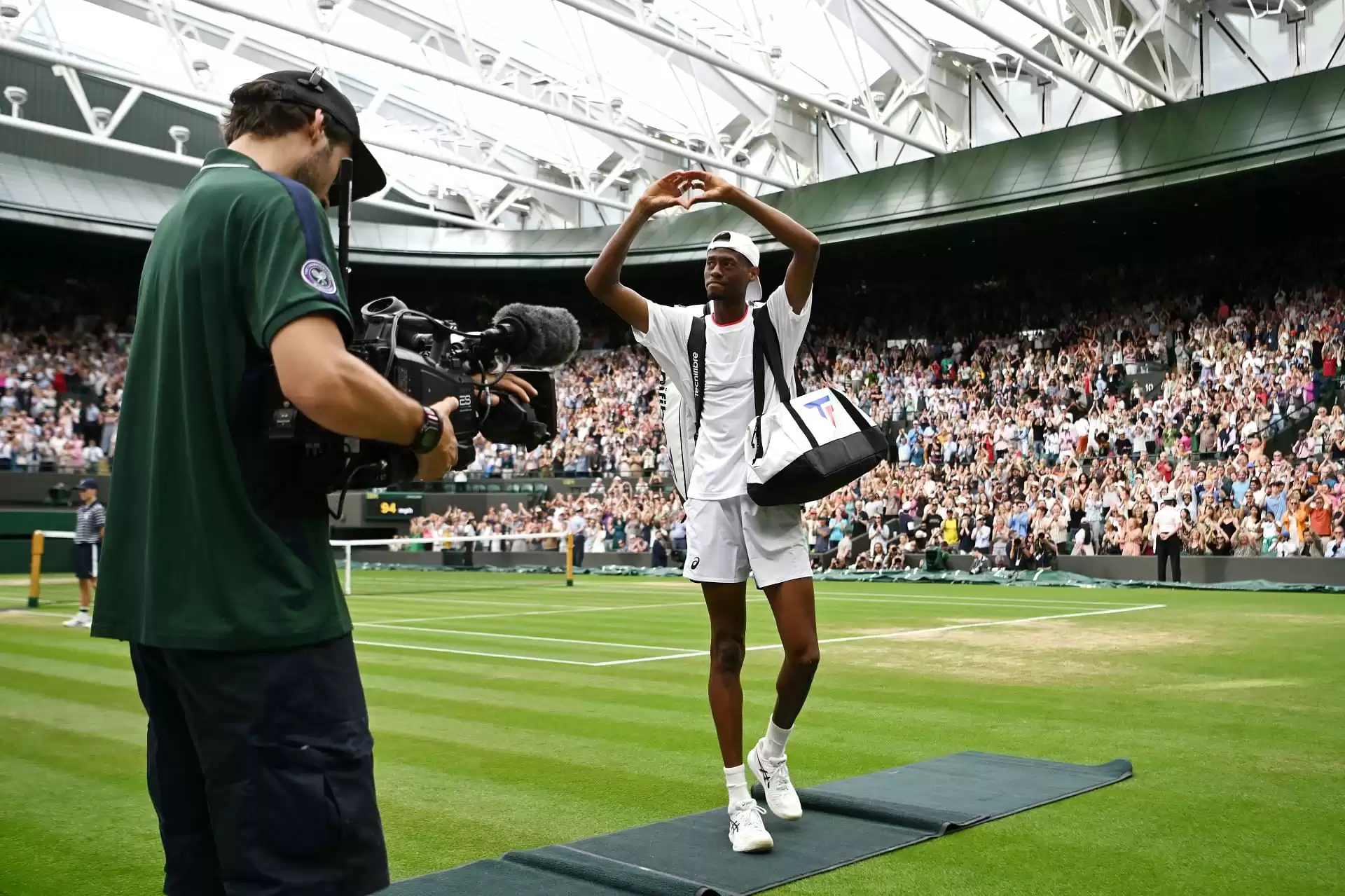 Christopher Eubanks playfully teases Coco Gauff for snacking during American's Wimbledon quarterfinal against Daniil Medvedev.