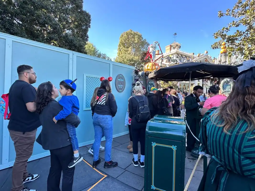 Construction walls haunted mansion queue Disneyland Park grounds refurbishment