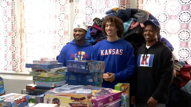 KU football players toy coat drive Lawrence kids in need