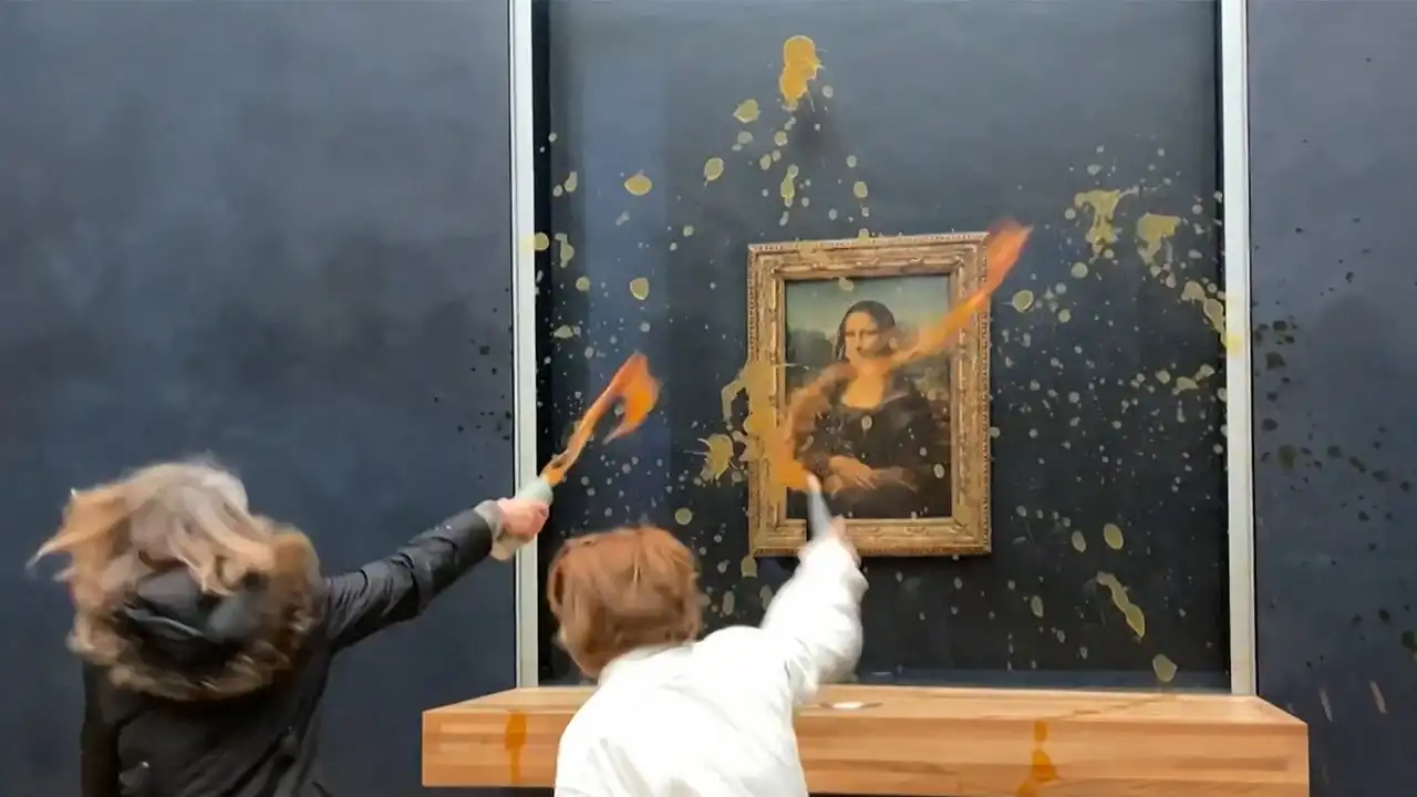 Mona Lisa splattered pumpkin soup protesters Paris