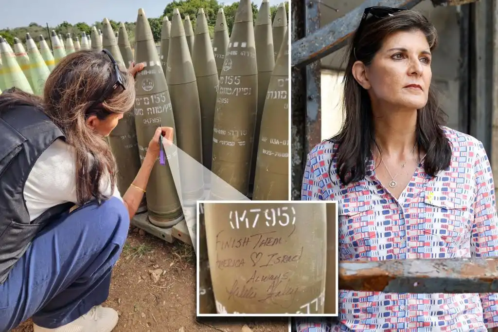 Nikki Haley signs IDF bomb during visit to Israel Finish them
