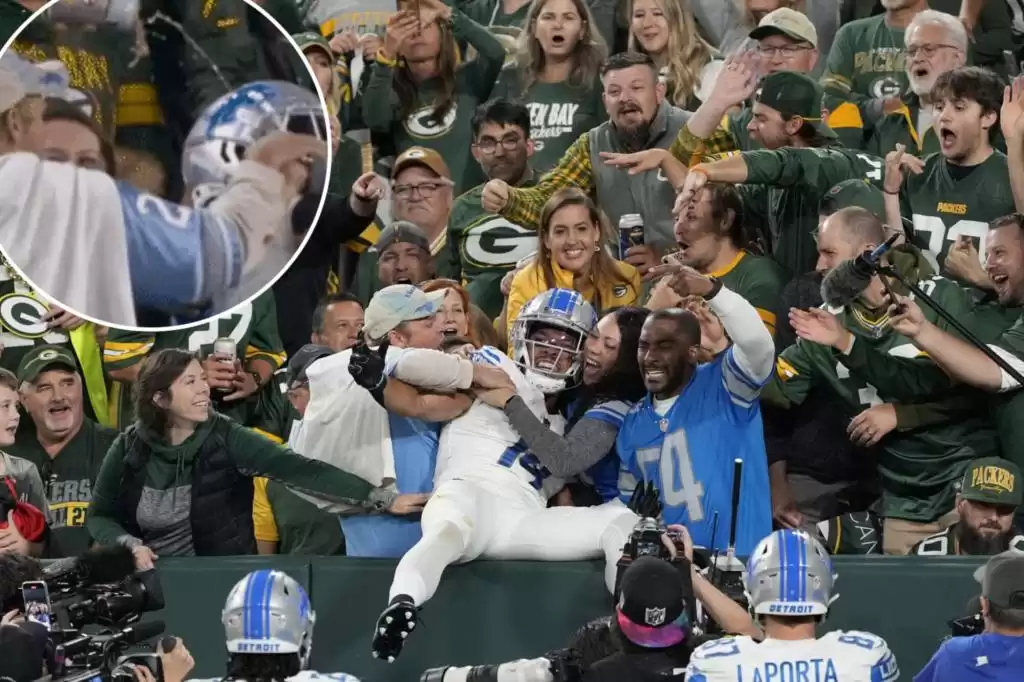 Packers fan dumps beer on Lions' Amon-Ra St. Brown after Lambeau incident