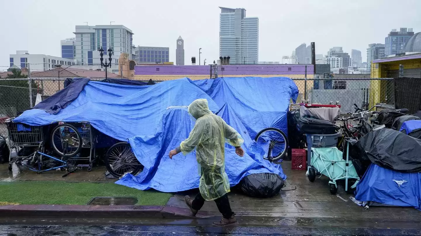 Rains from Tropical Storm Hilary swamp roads, trap cars in California and Mexico