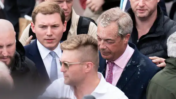 Woman charged assault milkshake thrown Nigel Farage